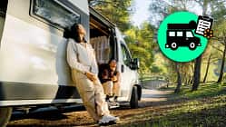 Couple enjoying the campervan in the forest, couple in love resting between trees with the campervan, roadtrips theme