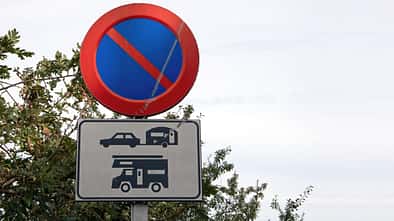 No parking for caravans and campervans traffic warning sign