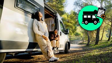 Couple enjoying the campervan in the forest, couple in love resting between trees with the campervan, roadtrips theme