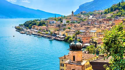 garda,limone,lago,vacation,view,mediterranean,coast,alpine,alps,boat,garda lake,resort,italia,scenics,aerial,beautiful,lemon,panorama,famous,destination,building,heritage,urban,landscape,colorful,italian,european,lombardia,landmark Beautiful village Limone Sul Garda on Garda Lake. The most famous tourist destination on lake. Aerial view. Lombardy, Italy.