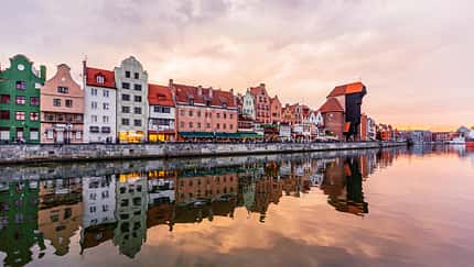 Gdansk skyline at sunset seen at the waterfront of Motlawa river, Gdansk, Poland