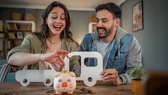 Young couple saving money for camper van road trip