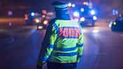 Police officer regulates traffic in a traffic accident, Stuttgart, Germany